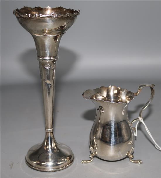An Edwardian silver cream jug and a silver posy vase.